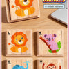 A set of four wooden jigsaw puzzles featuring forest animals like a lion, koala, elephant, and monkey.