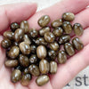 A handful of ten brown and gold resin starry sky cat's eye beads for jewelry making