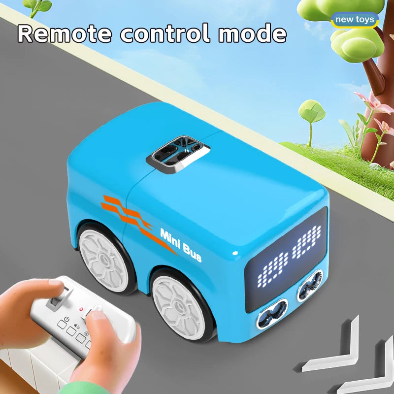 A blue Mini Bus toy is shown being controlled by a hand using a remote control, demonstrating the remote control mode.