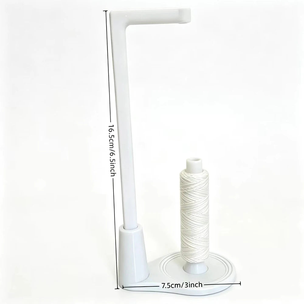 A white vertical sewing machine spool holder with a guide for anti-tangle thread.