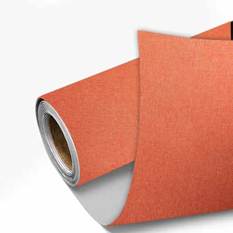 Rolls of orange linen book binding cloth used for albums and scrapbooks