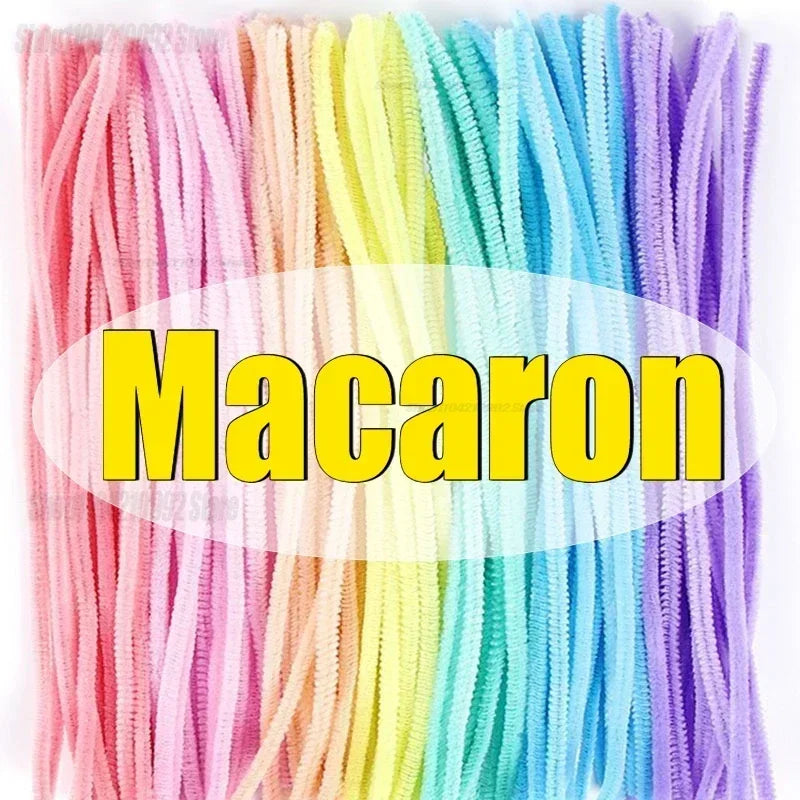 A bundle of colorful, bendable chenille craft stems in a rainbow gradient.