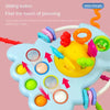 A blue sensory toy with various colorful parts and a sliding button for babies