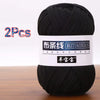 A black ball of soft chunky t-shirt yarn for crochet and knitting, packaged as a 2-pack.