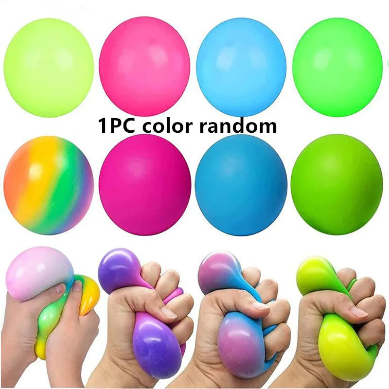 A collection of colorful slow-rise stress relief balls in various shades including lime green, pink, blue, and yellow, shown 