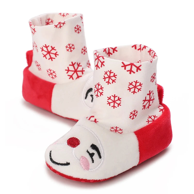 Pair of adorable animal-themed baby first walker shoes in red and white with snowflake patterns