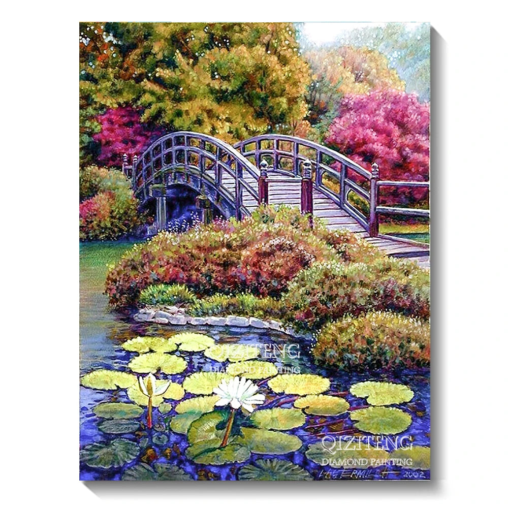 A diamond painting depicts a lush forest landscape featuring a wooden bridge over water and colorful foliage.