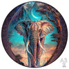 A circular jigsaw puzzle depicting an elephant silhouette against a blue and purple background.