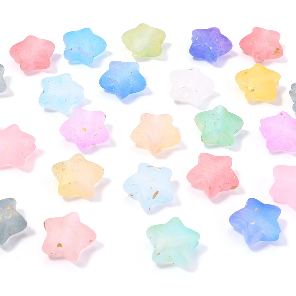 A collection of colorful transparent star acrylic beads in various pastel shades scattered on a white background.