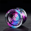 A close-up shot of a professional metal yo-yo with a vibrant purple and blue iridescent finish.