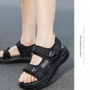 A close-up of black non-slip summer sport sandals worn on a person's foot.