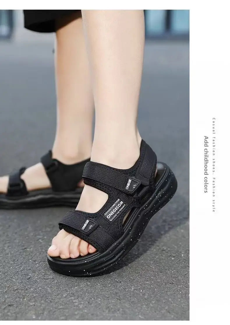 A close-up of black non-slip summer sport sandals worn on a person's foot.