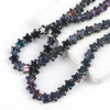 A strand of dark iridescent glass star spacer beads for jewelry making