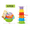 A set of six boat-shaped stacking cups for toddlers in various colors, including purple, yellow, orange, and blue.