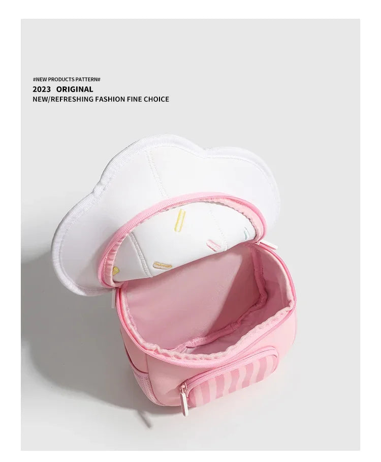 A pink mini backpack with a white lid featuring a mushroom print and striped trim.