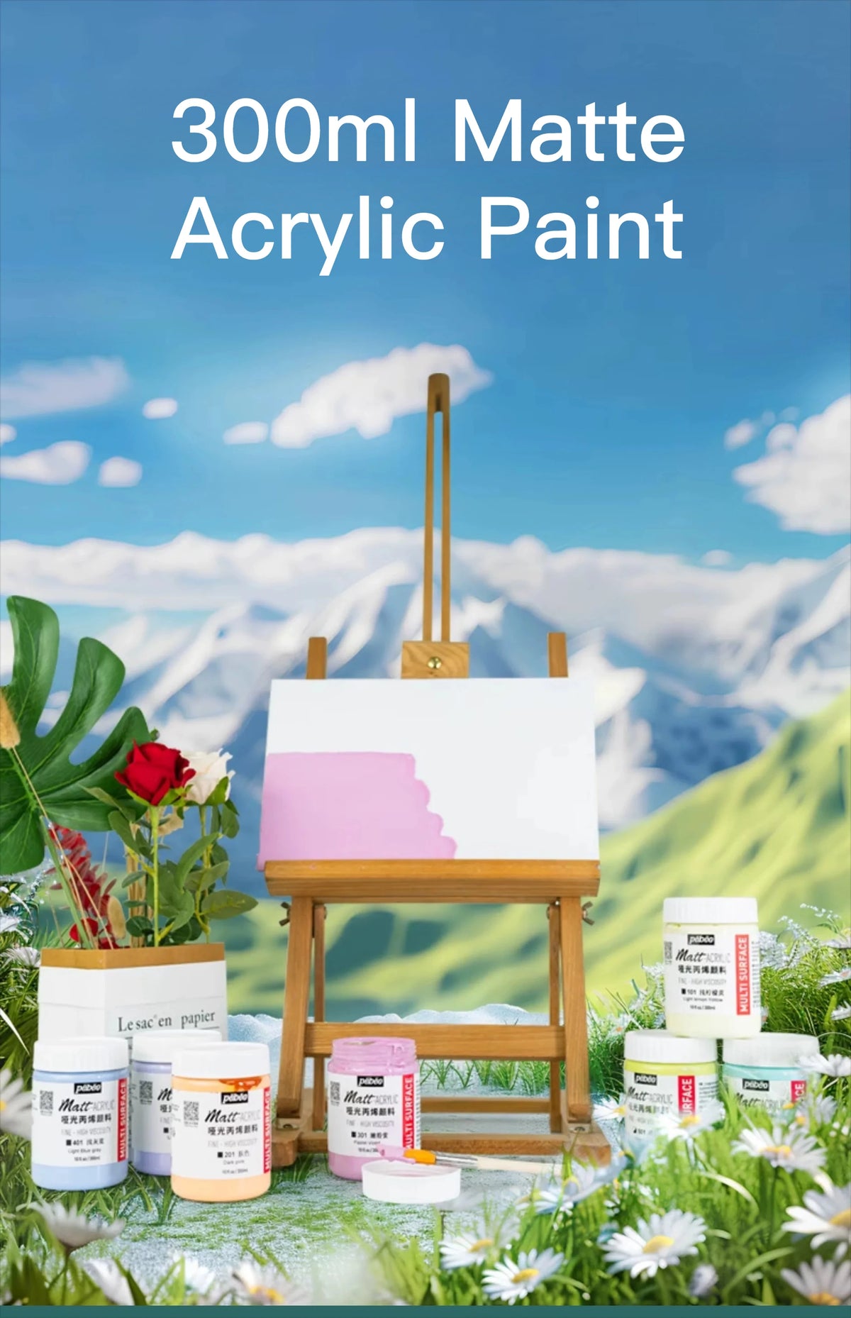 A bottle of 300ml Matte Acrylic Paint is displayed in a natural outdoor setting with paint palettes and greenery.