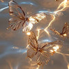 A close-up of a translucent butterfly painted by numbers on canvas, illuminated by bright light reflecting off the wings.