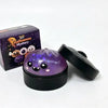 A black squishy stress relief toy with purple glow and a box labeled Halloween Mystery.