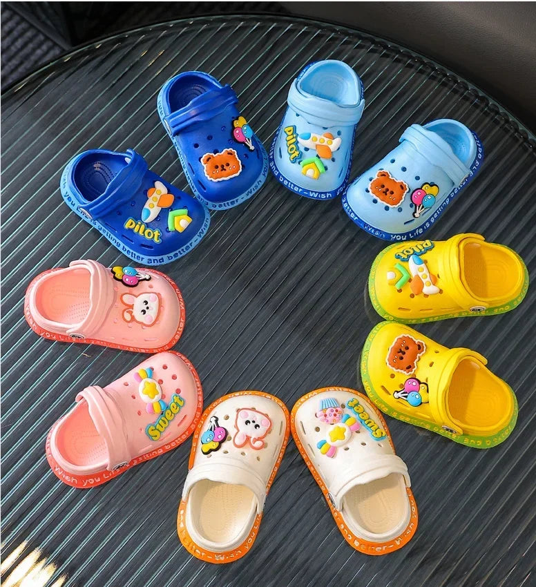 A collection of colorful lightweight children's plastic clogs in various shades of blue, pink, and yellow.