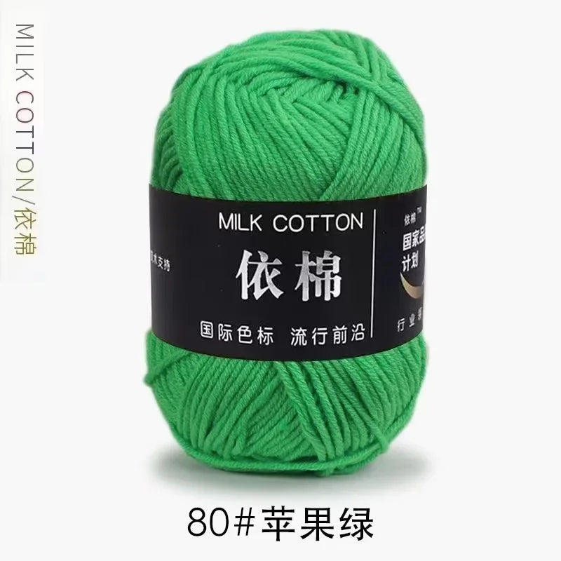 A ball of bright green milk cotton yarn labeled with Chinese characters and the number 80