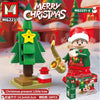 A set of Merry Christmas building blocks featuring a green Christmas tree and a character in red and green attire.