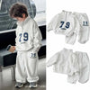 A set of gray long-sleeve sweater and sweatpants for a child, featuring the number 79 on the chest.