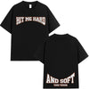 Black t-shirt with 'HIT ME HARD' and 'AND SOFT THE TOUR' text printed in orange on the front.