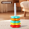 A stack of colorful plastic rings and a white spiral tower toy for toddlers.