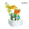 A set of 151 plastic building blocks shaped like rose flowers and leaves forming a bouquet.