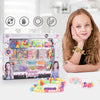A box of DIY bead jewelry making kit for kids with various beads and tools, next to finished beaded bracelets.