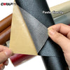 A hand is applying a black PU leather self-adhesive repair patch onto a dark leather surface.