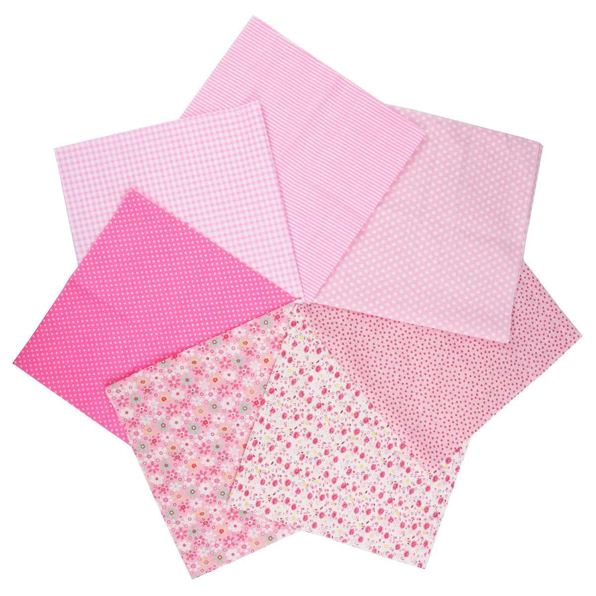 A stack of seven pink cotton fabric squares with various floral and polka dot patterns for quilting