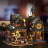 A detailed wooden 3D puzzle dollhouse kit depicting a magical city castle with intricate architecture and figures.