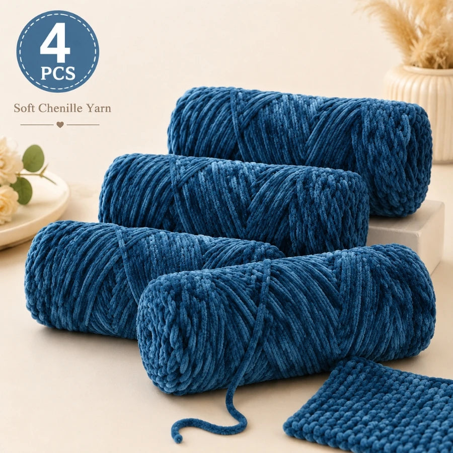 A pack of four skeins of deep blue soft chenille yarn used for crochet and knitting projects.