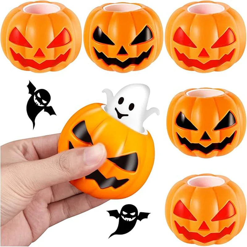 Orange Halloween pumpkin and black skeleton squeeze stress balls shown in a hand.