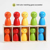A set of eight wooden dolls in various colors, including orange, red, yellow, green, and blue, arranged in a box.