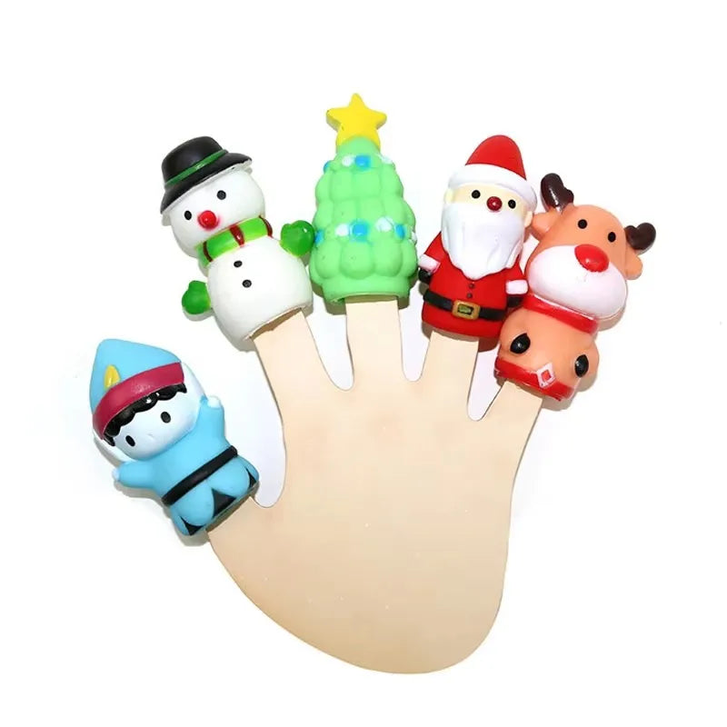 A set of animal finger puppets featuring a snowman, Christmas elf, and a bear on a hand.