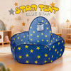 A blue star themed play tent with a mesh window is set up on a wooden floor.