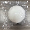 A white strawberry crunchy squishy stress relief toy is sealed in clear plastic packaging.