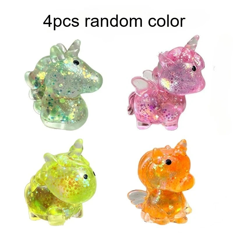 Four random color glitter unicorn stress balls shown in various angles