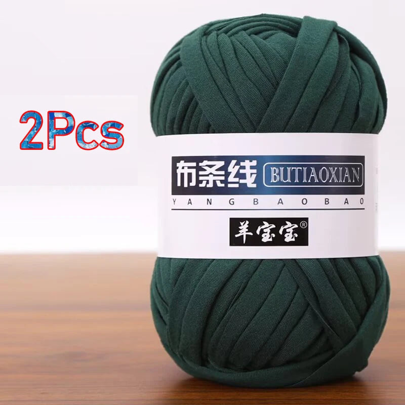 Two skeins of dark green soft chunky yarn for crochet and knitting projects