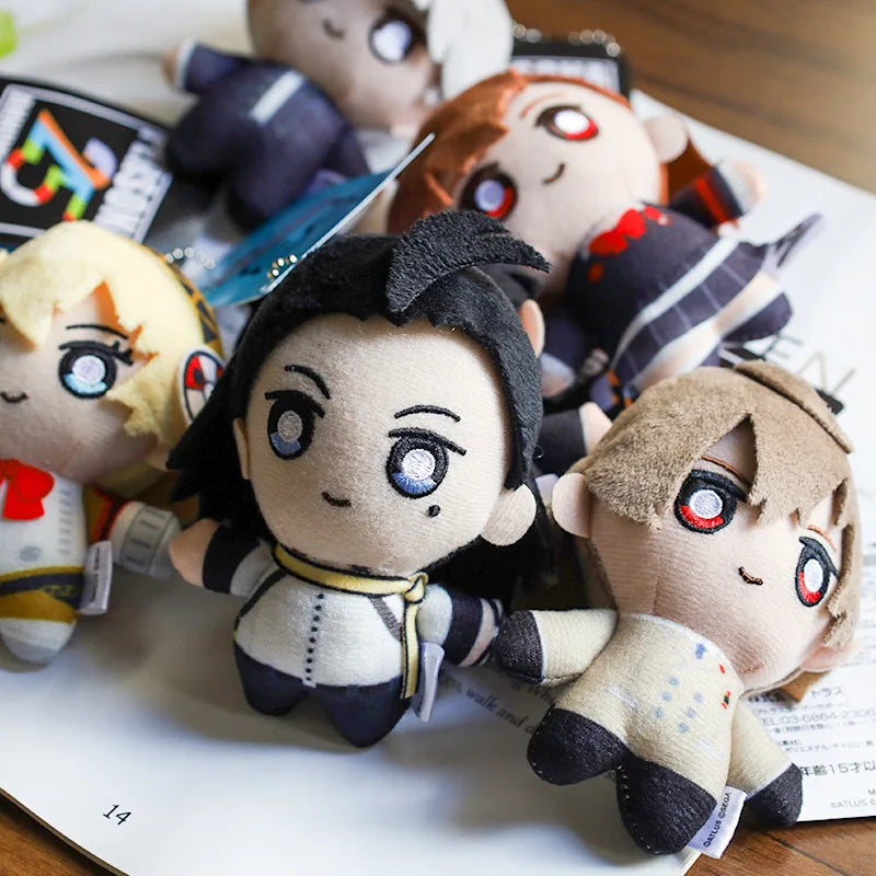 A collection of anime character plushie pendants and charms featuring various characters with distinct hair colors and facial