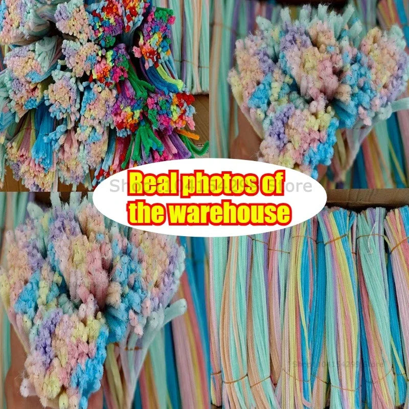 A close-up of colorful chenille wire craft sticks in various shades of blue, pink, and purple.