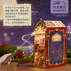 A wooden puzzle kit shaped like a castle with an interior scene, displayed on a wooden surface.