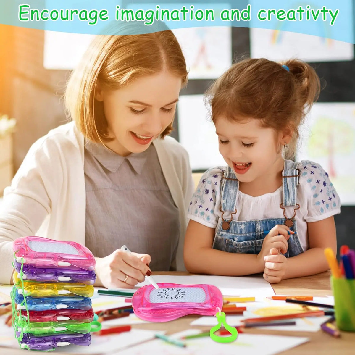 A woman and a girl are drawing on a board with colorful magnetic shapes and tools.