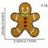 A round, brown cartoon character patch with a green bowtie and red buttons, measuring 6.6cm by 2.1g.
