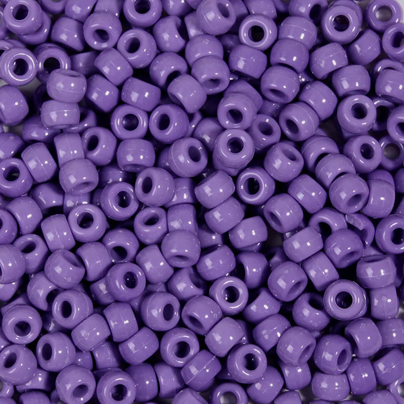 A close-up view of a large pack of purple pony beads for jewelry making and craft projects.