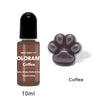 A brown glass bottle of Olorant Coffee liquid pigment with a black cap and a paw print design.