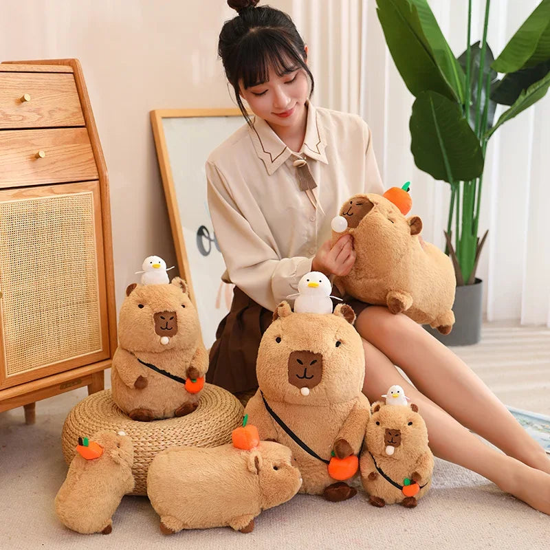A collection of brown capybara plush toys in various outfits sitting on a light-colored floor.