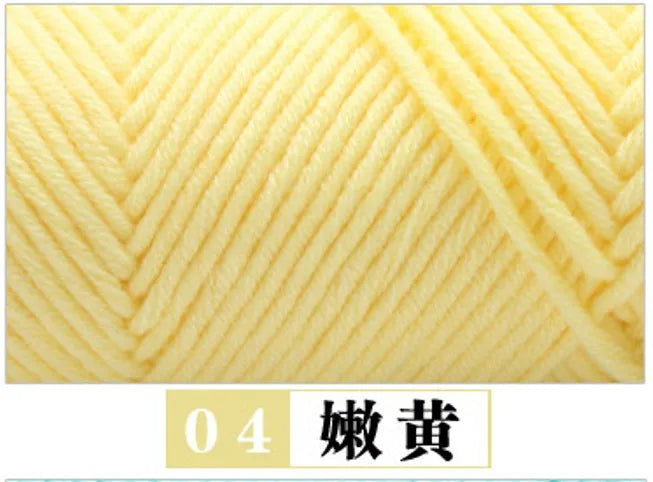 A close-up view of yellow premium milk cotton yarn used for knitting or crafting.